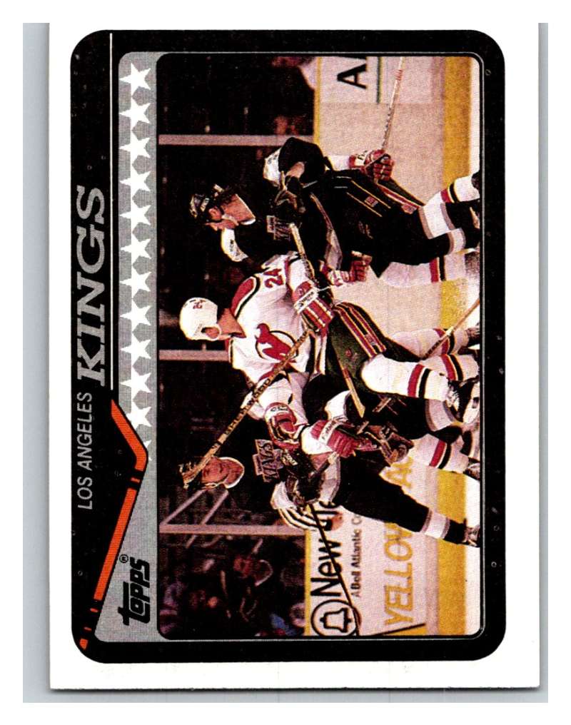 1990-91 Topps #17 Kings Team Mint Image 1