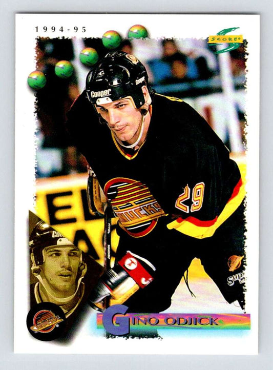 1994-95 Score Hockey #9 Gino Odjick  Vancouver Canucks  V90674 Image 1
